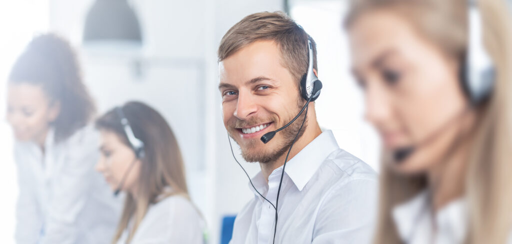 Call center worker accompanied by his team.